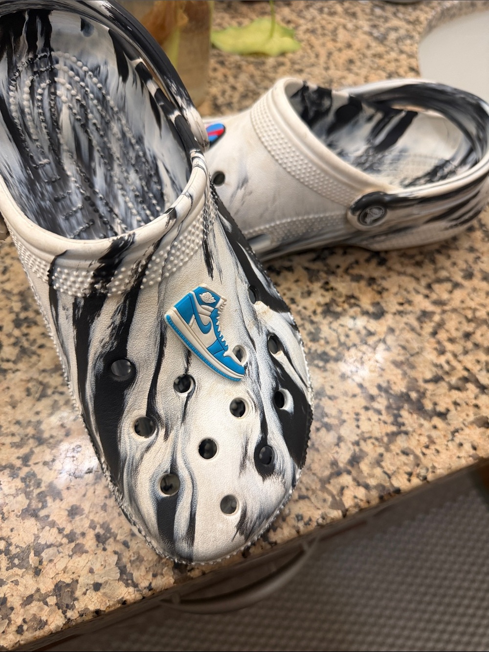 CROCS Black and White Marble Classic Clog with Blue Sneaker Charm